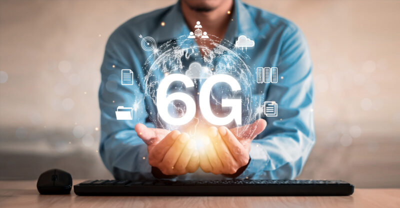 6g wireless concept image with man holding energy