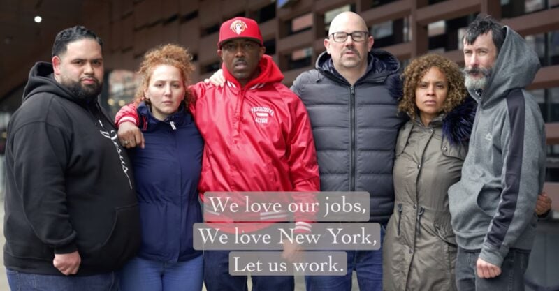 varied group of fired New York City workers standing shoulder to shoulder