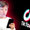 child holding cellphone with facial recognition and tiktok logo