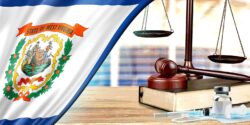 gavel with vaccine bottle and West Virginia flag