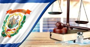 gavel with vaccine bottle and West Virginia flag
