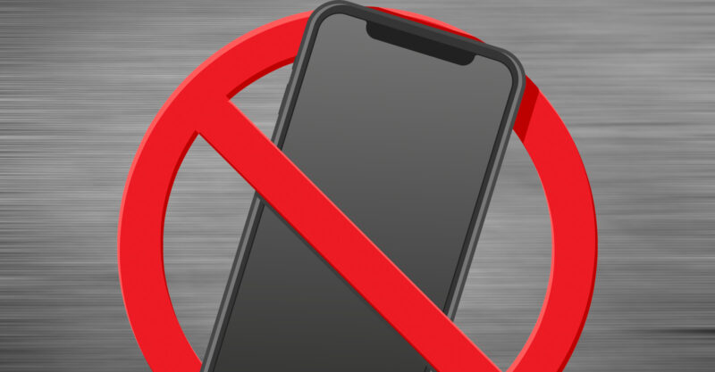 Graphic with a red line through smartphone.