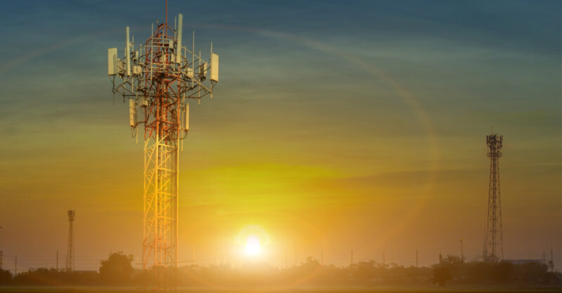 Sunset behind communications towers.