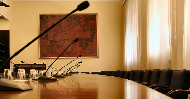 Microphones in empty conference hall.