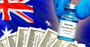 australia flag, money and astrazeneca covid vaccine bottle