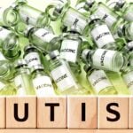 vaccine bottles and word "autism"