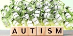 vaccine bottles and word "autism"