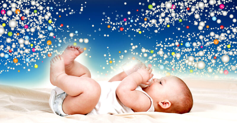 baby holding bottle and microplastics in background