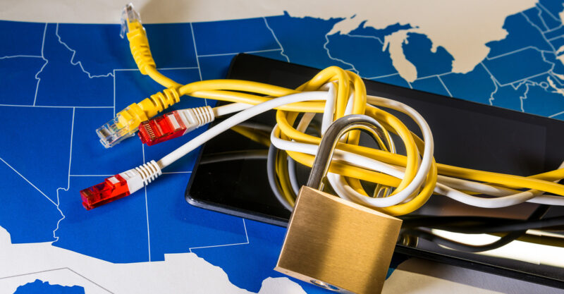 knotted ethernet cable around a padlock over a US map