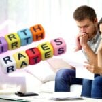 stressed couple and words "low birth rates"
