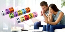 stressed couple and words "low birth rates"