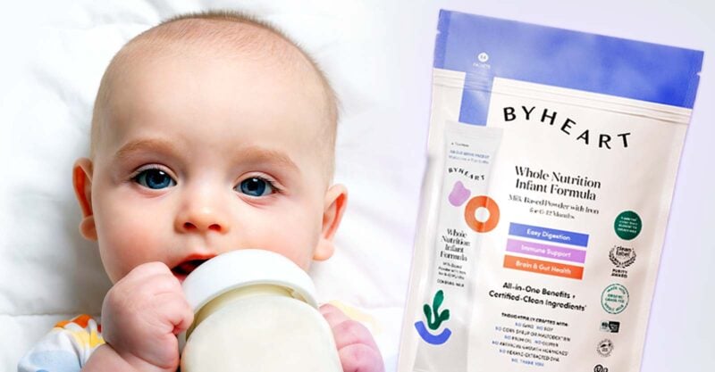 baby drinking milk and package of byheart