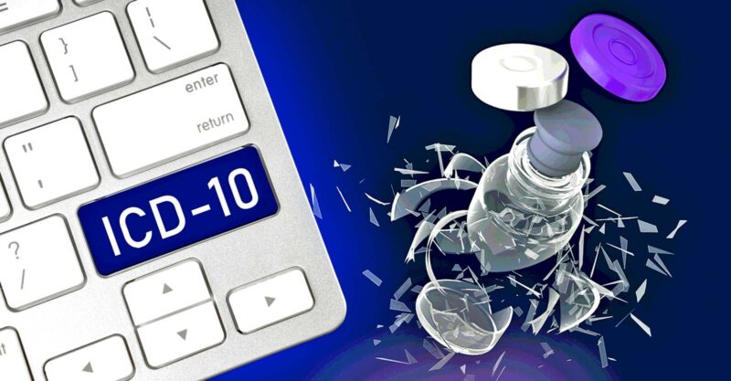 broken vaccine bottle and keyboard with letters "ICD-10" on it