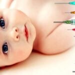 baby and vaccine syringes