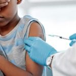 child getting vaccine in arm