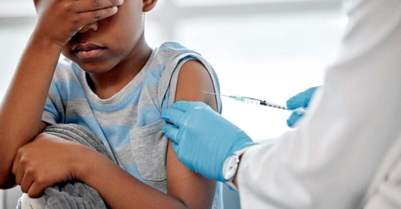 child getting vaccine in arm