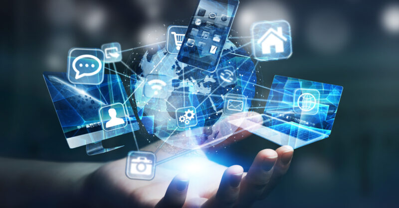Tech devices and icons connected to digital planet earth.