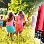 kids playing and cell tower