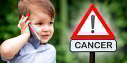 boy talking on cellphone with warning symbol that reads "cancer"