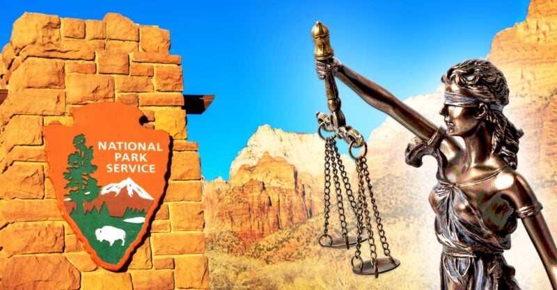 national park service sign and lady justice
