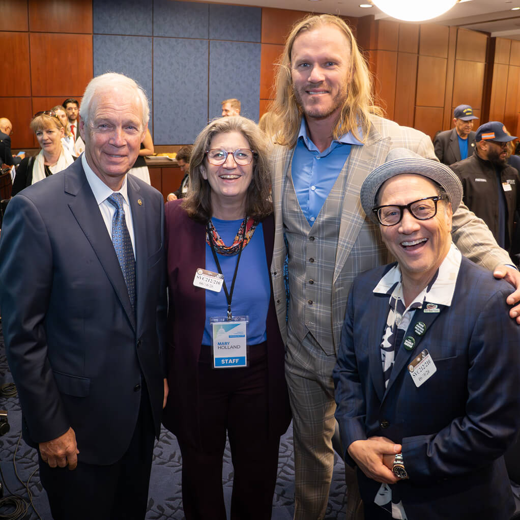 Senator Ron Johnson, Mary Holland, and Rob Schneider