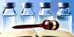 vaccine bottles with gavel on book