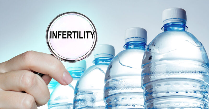 Water bottles with a magnifying glass with infertility written inside