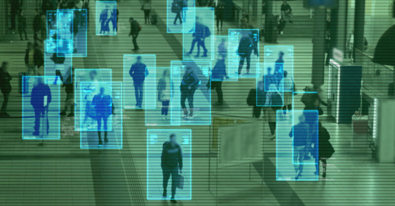 Scanning the crowd of people walking at the railway station. Surveillance interface using artificial intelligence and facial recognition.