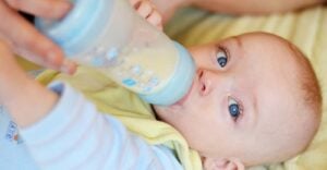 baby drinking from bottle