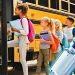 kids on bus and a vaccine bottle