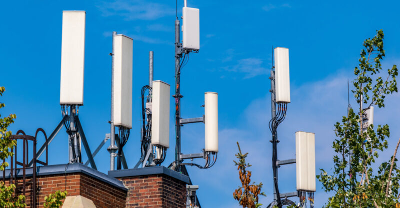 Cell phone transmission systems on the roof of an commercial building in East Toronto.