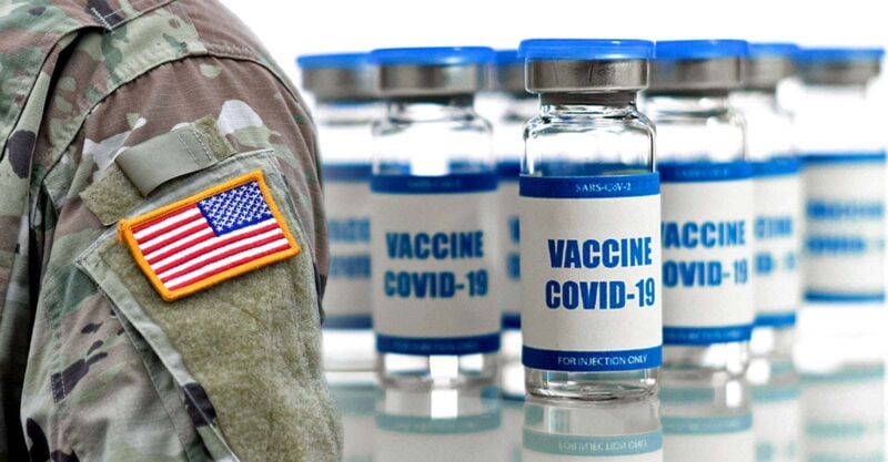 u.s. military uniform and covid vaccine bottle