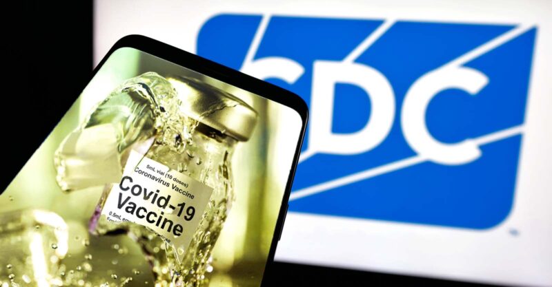 cdc logo and broken covid vaccine bottle