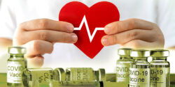 child hands holding heart and covid vaccine bottles