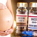 pregnant woman and covid vaccine bottles