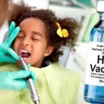 young girl at dentist and hpv vaccine bottle