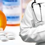 prescription drugs and doctor holding money