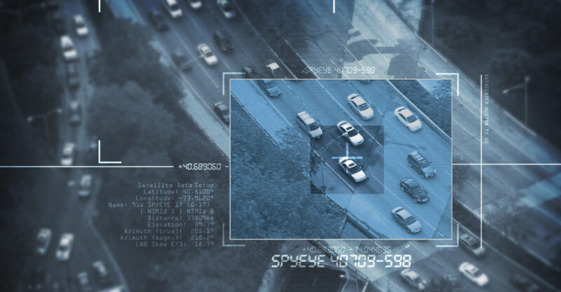 Spy Satellite depicted by zooming in on target on highway.