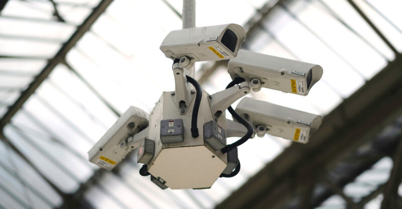 Multiple surveillance cameras mounted in a ceiling