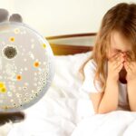 girl sneezing and petri dish of bacteria