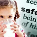 child drinking milk and word "safety"