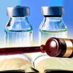 vaccine bottles and gavel