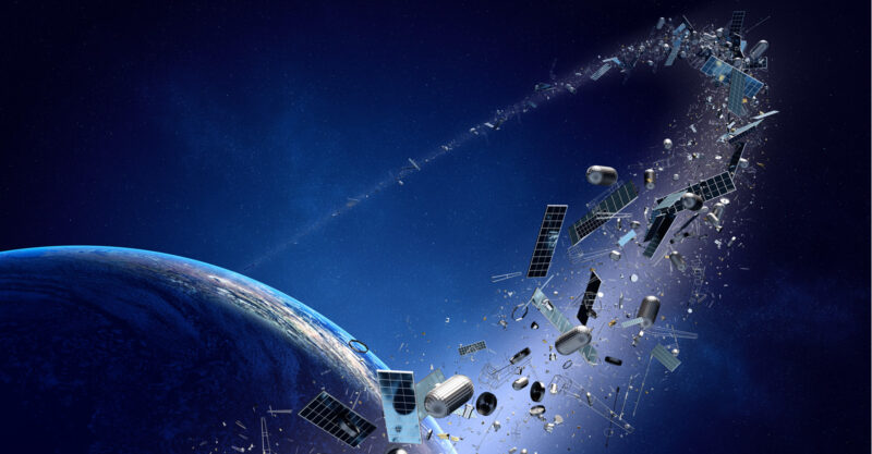 Graphic of space junk, broken satellites orbiting Earth.
