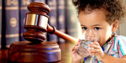 gavel and toddler drinking water