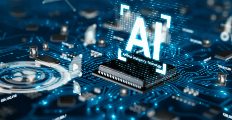 AI computer chip on circuit board concept with the letters AI.