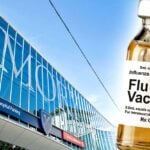 Emory Healthcare building and flu vaccine bottle