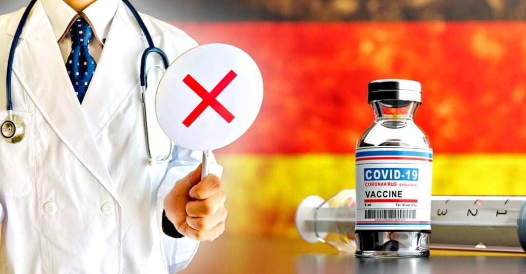 germany flag and covid vaccine with doctor holding up sign with "x" on it