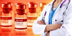 covid vaccine bottles and healthcare worker