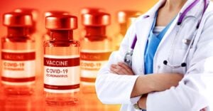 covid vaccine bottles and healthcare worker