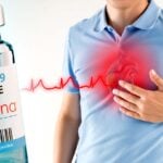 moderna covid vaccine and man holding heart